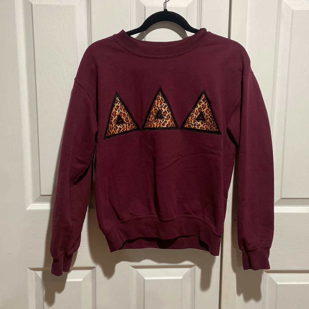 Maroon TRIDELTA cheetah print letters sweater